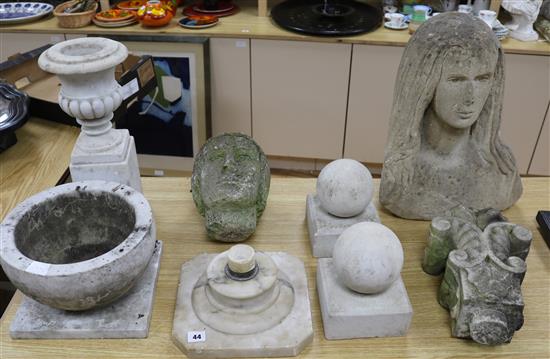 A stone head, another, pair of finials, mortar, etc tallest piece 47cm
